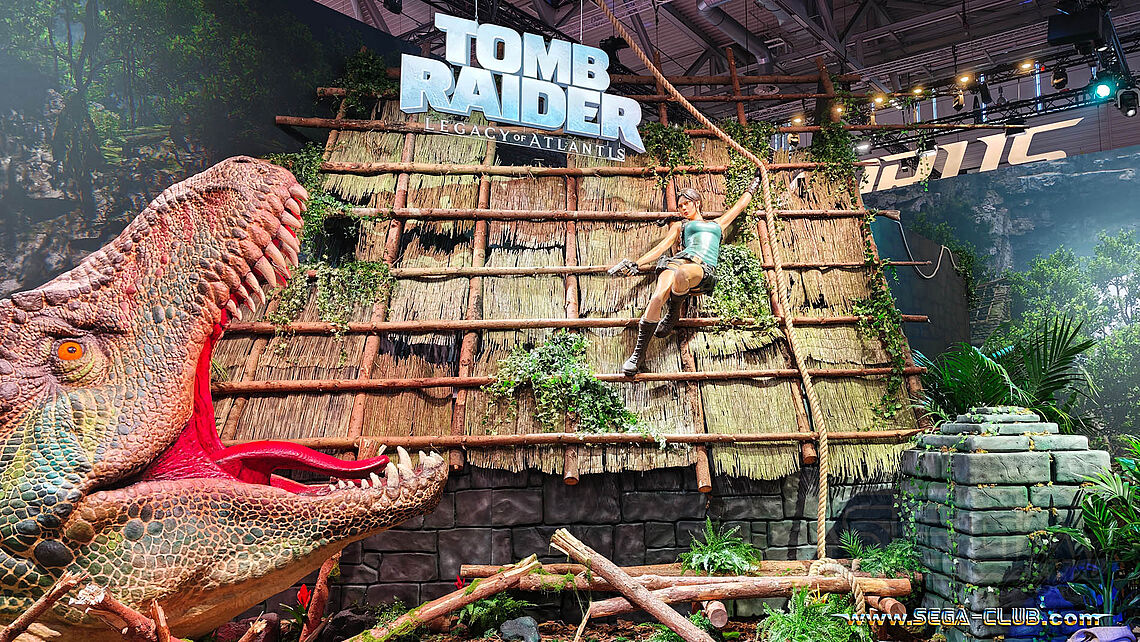 Bei Tomb Raider: Legacy of Atlanta versucht Lara einem aus dem Boden kommenden T-Rex zu entkommen - Standdesign vom Feinsten